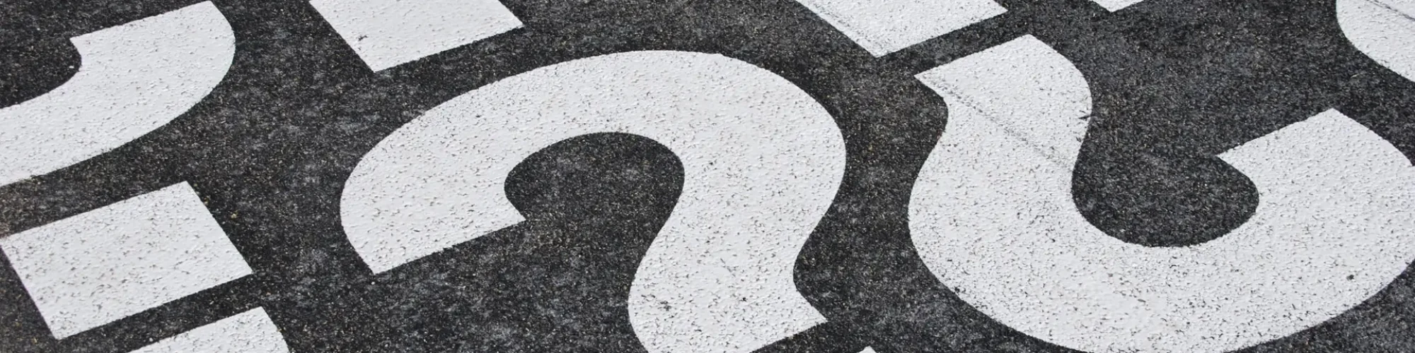 Question mark sign question mark signs painted on a asphalt road surface