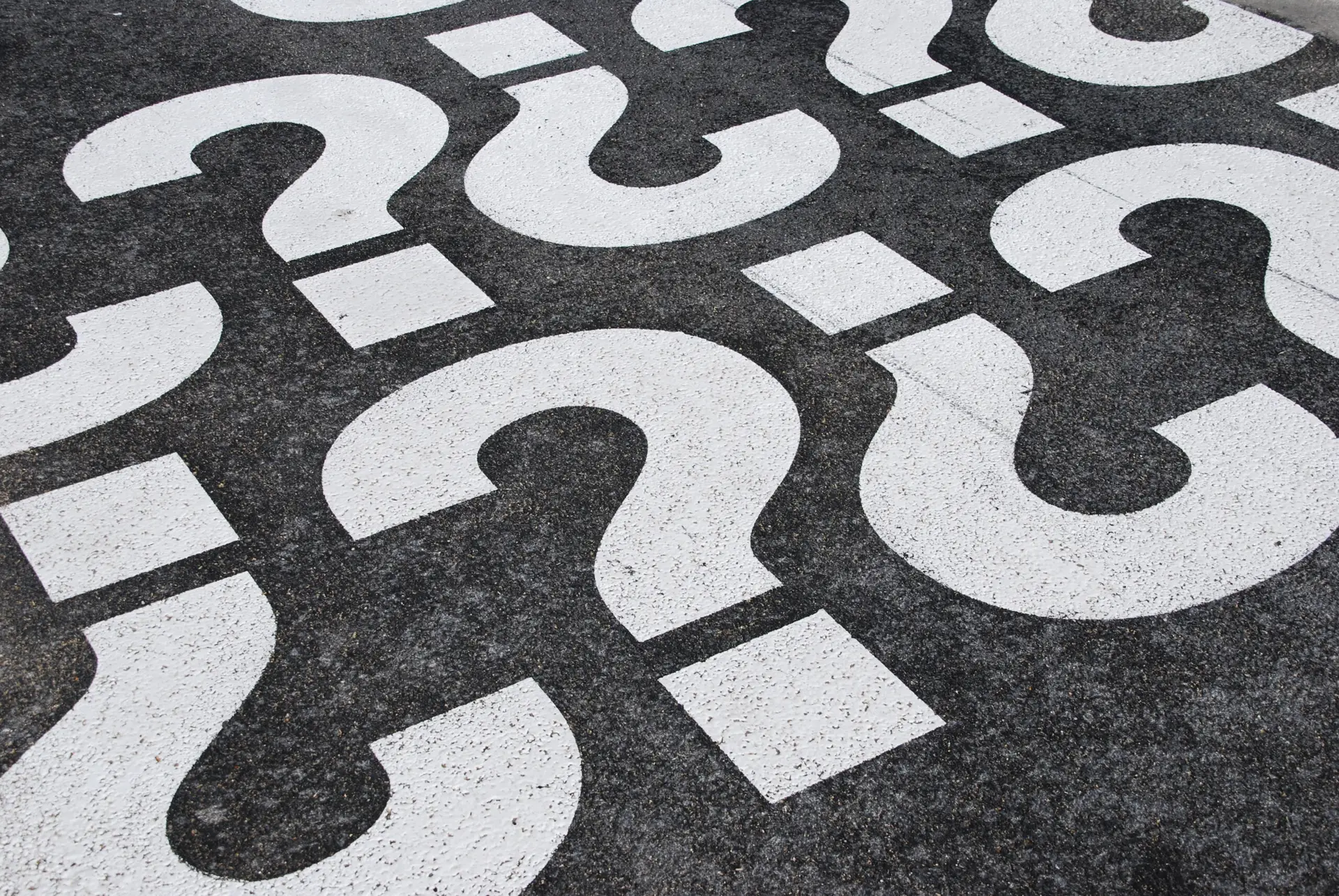 Question mark sign question mark signs painted on a asphalt road surface